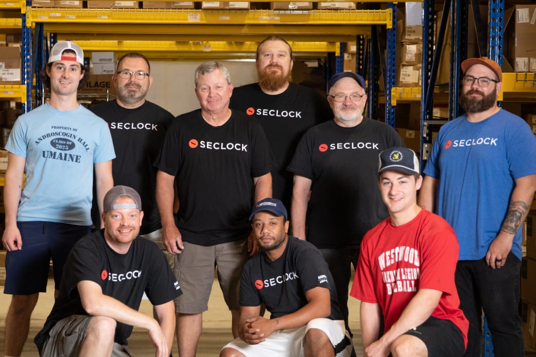 A group of SECLOCK employees standing together for a photo